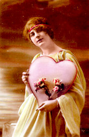 woman holding an early valentines day card